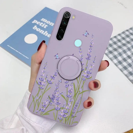 a woman holding a phone case with lavender flowers