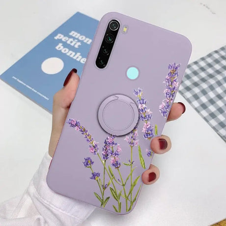 a woman holding a phone case with lavender flowers