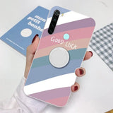 a woman holding a phone case with the words go luck