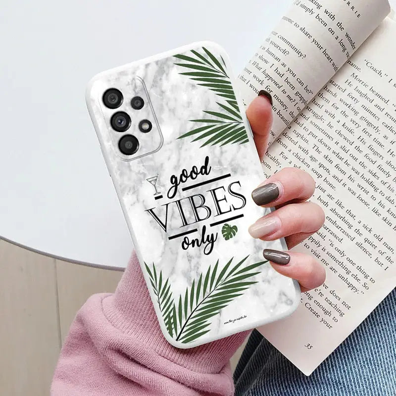a woman holding a phone case with the words’yes ’