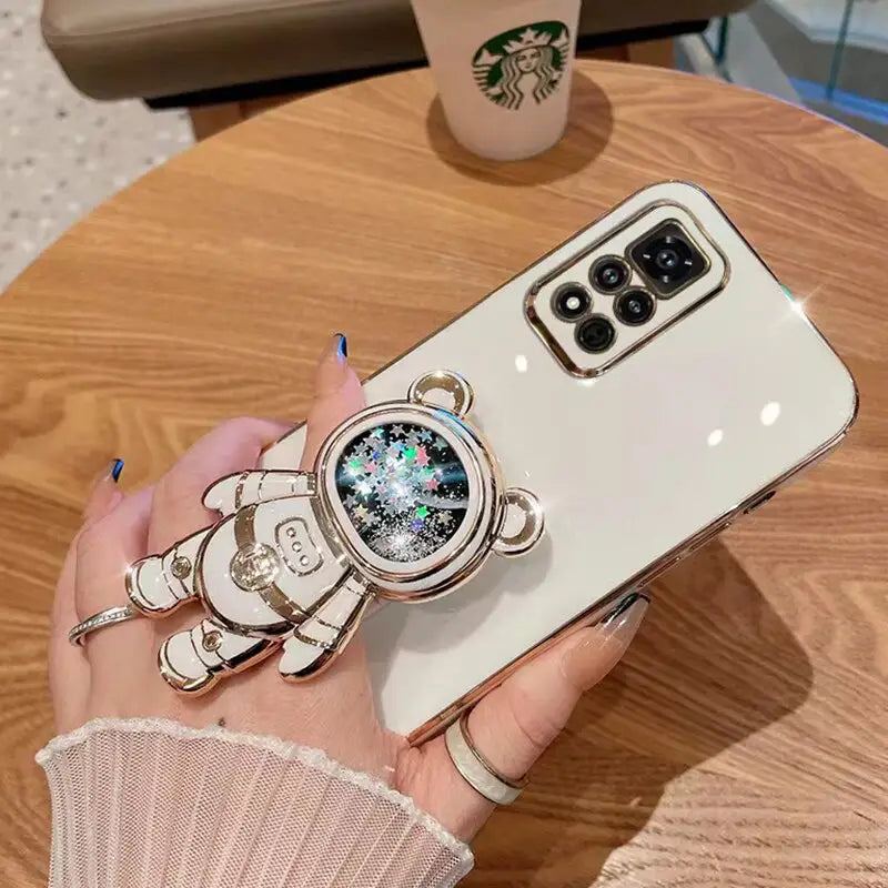 a woman holding a phone case with a watch on it