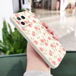 a woman holding a phone case with flowers on it