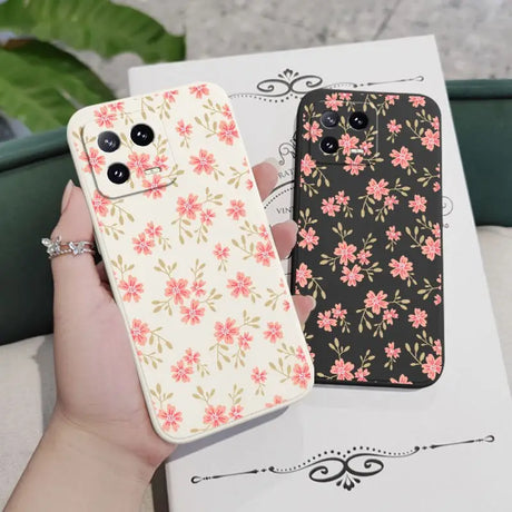 a woman holding a phone case with flowers on it