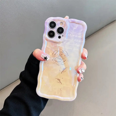 a woman holding a phone case with a drawing on it