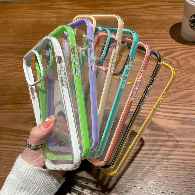 a woman holding a clear phone case with multiple colors