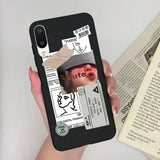 a woman holding a phone case with a picture of a man