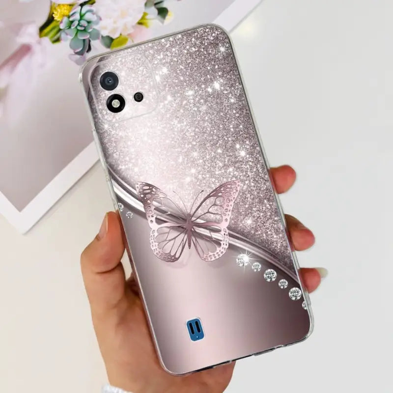 a person holding a phone case with a butterfly on it