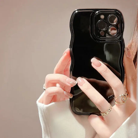 a woman holding a phone in her hand