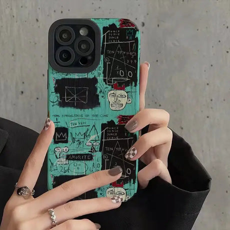 a woman holding a phone case with a pattern on it