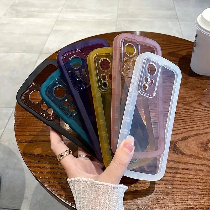 a woman holding a phone case with a variety of colors