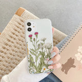 a woman holding a phone case with a flower design