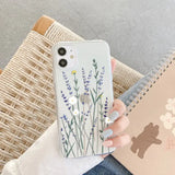 a woman holding a phone case with a flower design