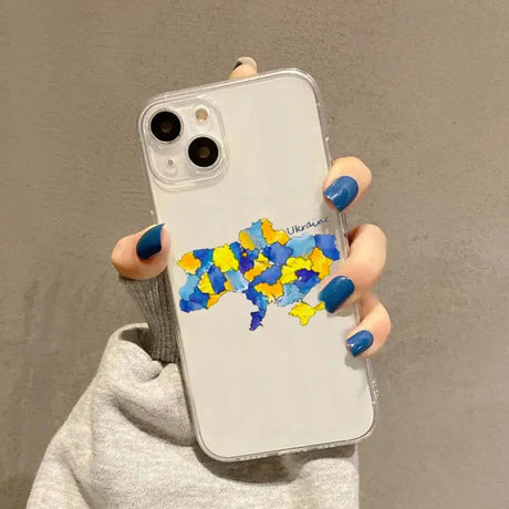 a woman holding a phone case with a map of the world