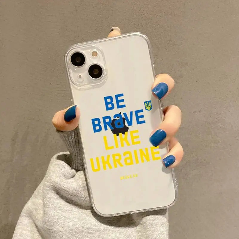 a woman holding a phone case with the words be like ukraine