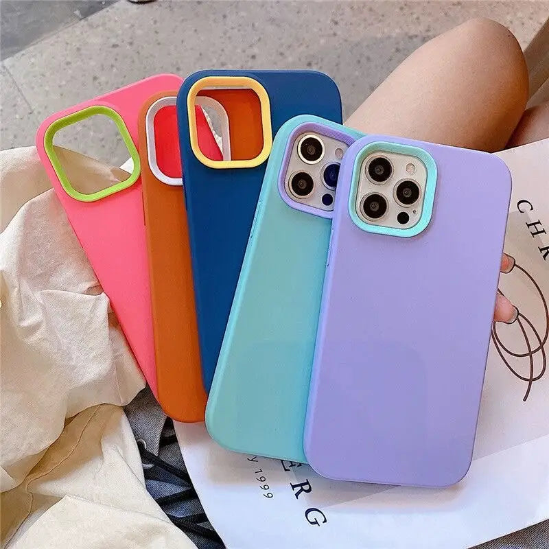 a woman holding a phone case with a colorful case