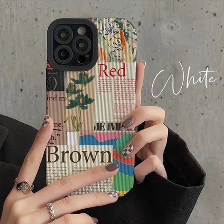 a woman holding a phone case with a colorful pattern