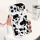 a woman holding a phone case with a cow pattern