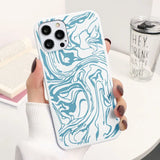 a woman holding a phone case with a blue marble pattern