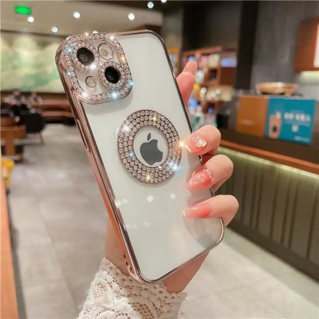 a woman holding a phone with a ring on it