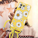 there is a woman holding a phone with a yellow case with white flowers