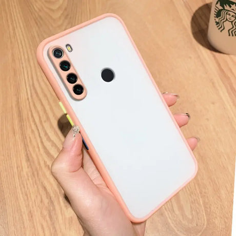 a woman holding a pink iphone case