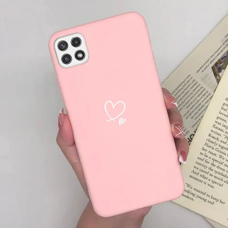 a woman holding a pink iphone case