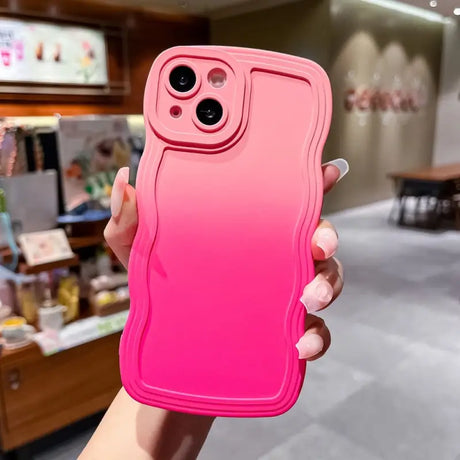 a woman holding a pink iphone case