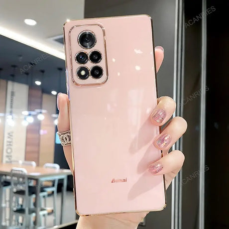 a woman holding a pink iphone case