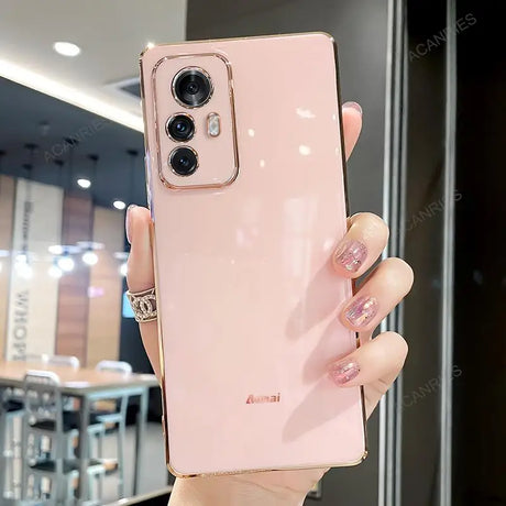 a woman holding a pink iphone case