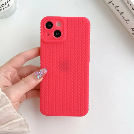 a woman holding a pink iphone case