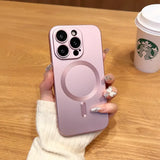 a woman holding a pink iphone case with a starbucks cup in the background