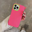 a woman holding a pink iphone case