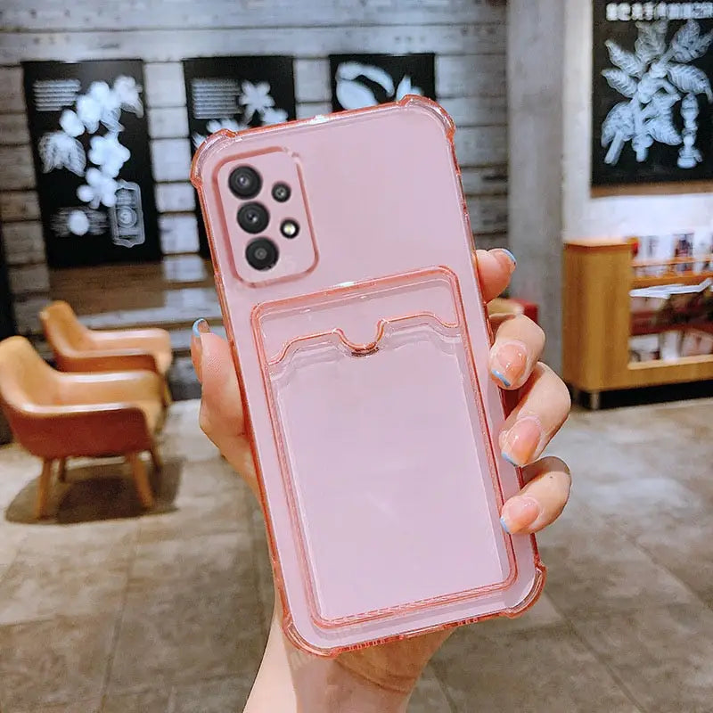 a woman holding a pink phone case