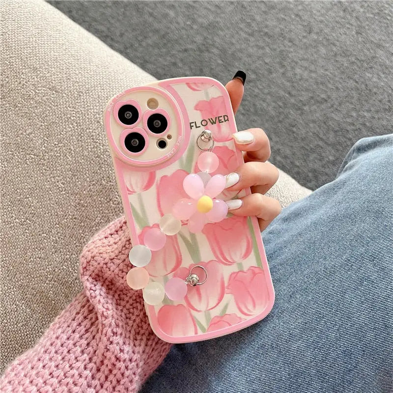a pink phone case with a flower on it