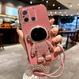 a woman holding a pink phone case with a camera
