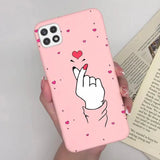 a pink phone case with a heart and a hand holding a finger
