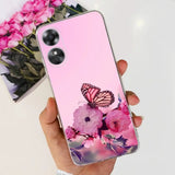 a woman holding a pink phone case with a butterfly on it