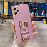 a pink phone case with a rabbit on it