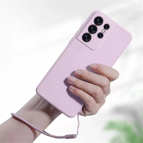 a woman holding a pink phone case