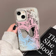 a woman holding a pink phone case with butterflies on it