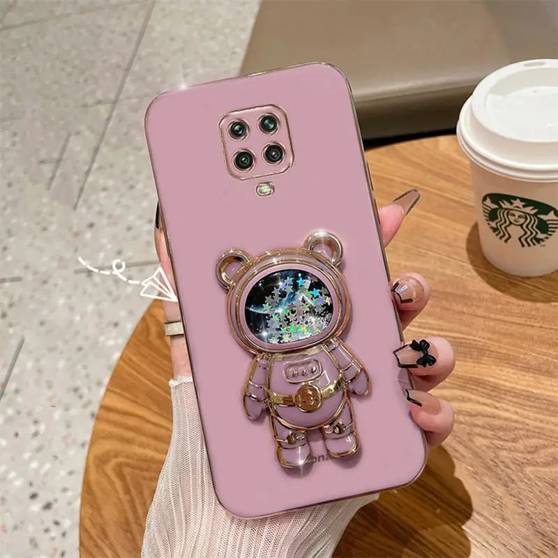 a pink phone case with a cute bear on it