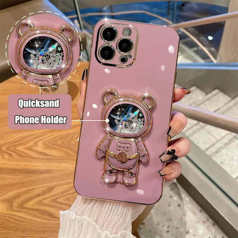 a pink phone case with a cute cat on it