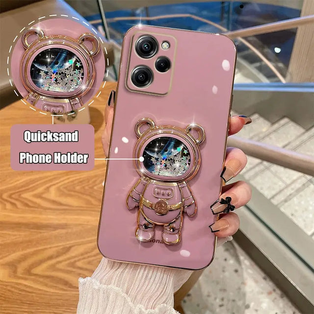 a person holding a pink phone case with a clock