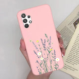 a woman holding a pink phone case with flowers