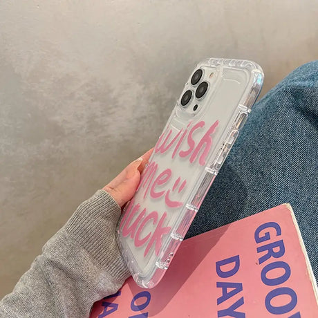 a person holding a pink phone case