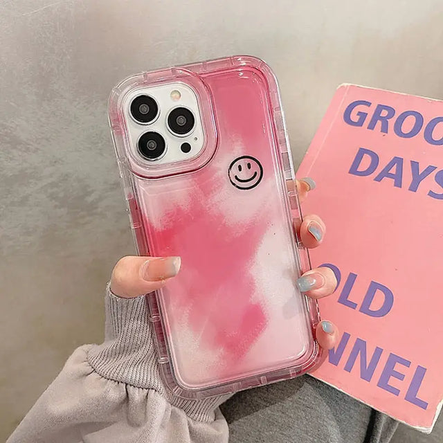 a woman holding a pink phone case with a pink cover that says good days