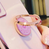 a pink ring with a pink heart on it