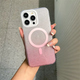a woman holding a pink and silver phone case