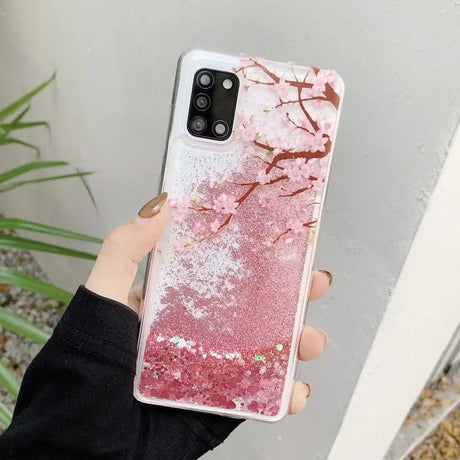 a woman holding a pink marble phone case