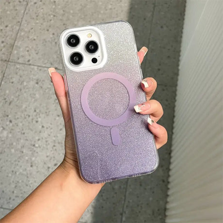 a woman holding a purple glitter phone case